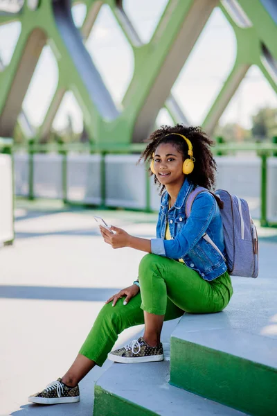 Multiracial Teenage Girl Backpack Headphones Smartphone Resting School City Bridge — Foto Stock