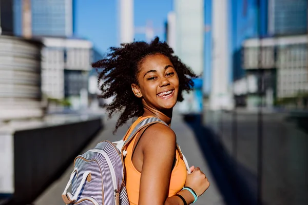Multiracial Teenage Girl Walking Backpack Modern City Centre Summer Day — Stok fotoğraf