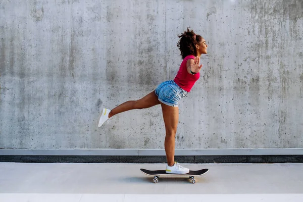 Multiracial Teenage Girl Riding Skateboard Front Concrete Wall Standing One — Stock Photo, Image
