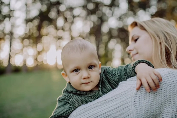 Mother Holding Her Little Baby Son Wearing Knitted Sweater Walk — 스톡 사진