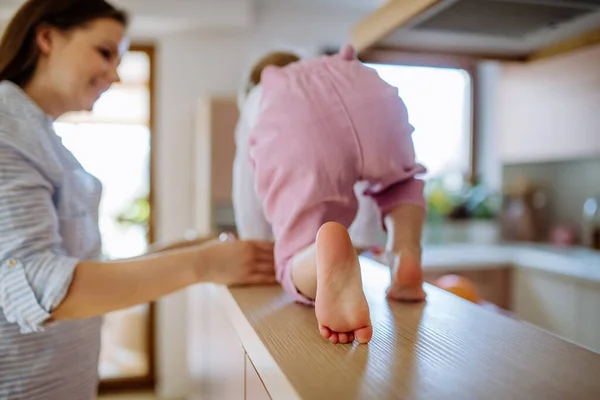 Young Mother Holding Her Little Daughter Walking Kitchen Counter Home —  Fotos de Stock