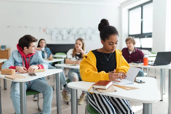 High School Students Paying Attention Class Sitting Desks Writing Notes — Stockfoto