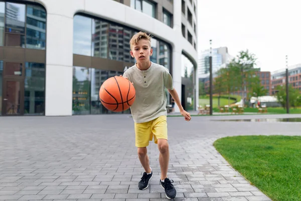 Cheerful Caucasian Boy Driblling Basketball Ball Public City Park Looking — Stock Photo, Image