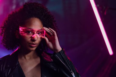 Metaverse digital cyber world technology, a man with virtual reality VR goggles playing augmented reality game, futuristic lifestyle
