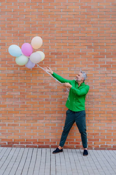 Fun Portrait Happy Energetic Mature Businessman Holding Balloons Street Feeling — Φωτογραφία Αρχείου