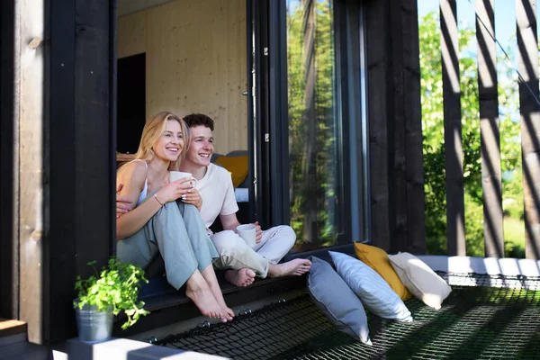 Young Couple Sitting Cuddling Cup Coffee Terrace New Home Tiny — Photo