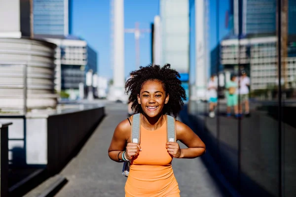 Multiracial Teenage Girl Walking Backpack Modern City Centre Summer Day — Stok fotoğraf