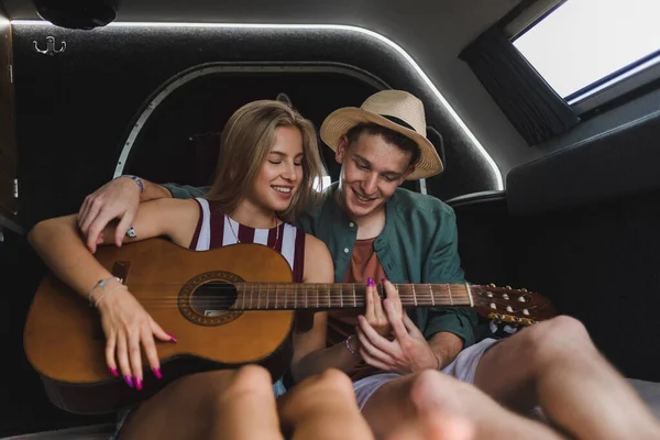 Happy Young Couple Sitting Together Van Camping Playing Guitair — Stock Fotó