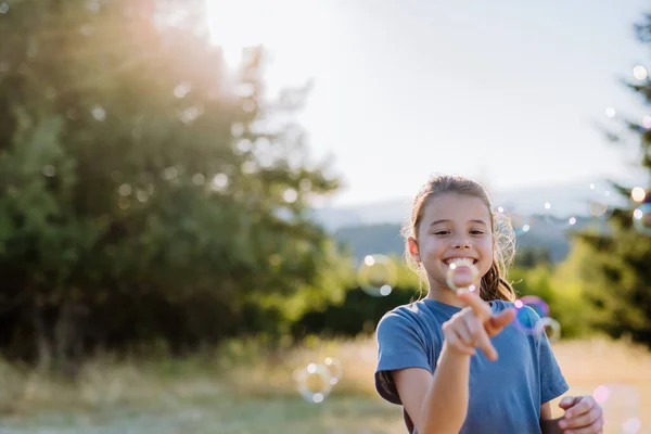 Little Girl Having Fun While Blowing Soap Bubbles Summer Day — Fotografia de Stock