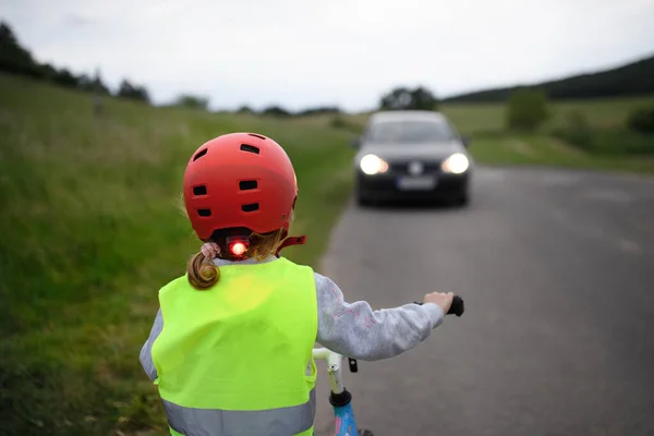 Rear View Child Riding Bike Road Car Front Her Road — Stock Photo, Image