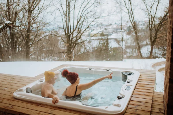 Senior Couple Knitted Cap Enjoying Together Outdoor Bathtub View Terrace — Stock Photo, Image