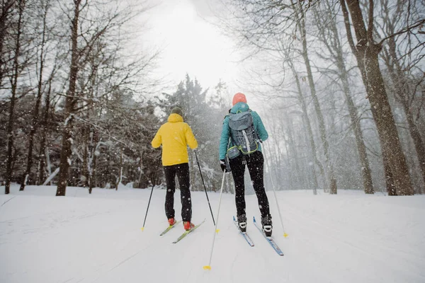 Senior Couple Skiing Togetherin Middle Snowy Forest — Stock Photo, Image