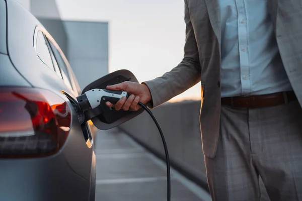 Man Holding Power Supply Cable Electric Vehicle Charging Station Closeup — Foto de Stock