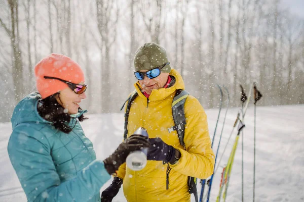 Senior Couple Resting Drinking Hot Tea Thermos Middle Snowy Forest — Stock Photo, Image