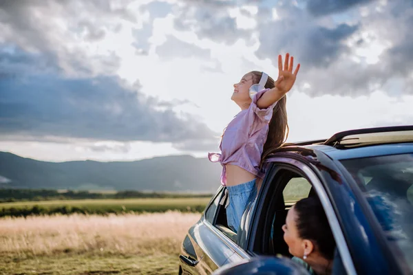 Little Girl Headphones Standing Leaning Out Car Window Ride — Stock Photo, Image