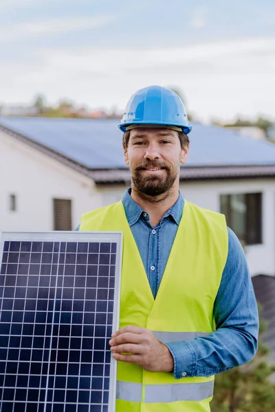Smiling Handyman Solar Installer Carrying Solar Module While Installing Solar — Zdjęcie stockowe