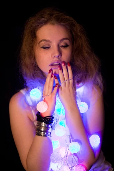 Young girl with Christmas garlands — Stock Photo, Image