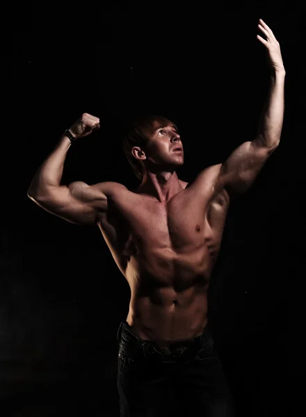Muscular young bodybuilder — Stock Photo, Image