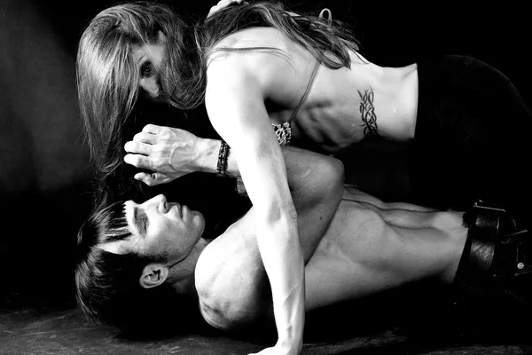 Young couple lying on the floor — Stock Photo, Image