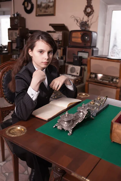 Fashionable girl in antique shop — Stock Photo, Image