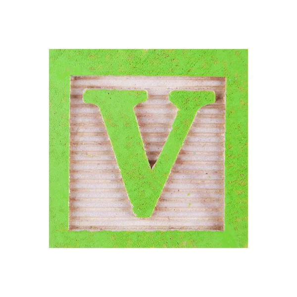 V harfi yontulmuş beyaz üzerine tahta blok yapıyor. — Stok fotoğraf