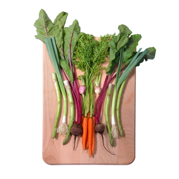 Verduras en una tabla de cortar una alimentación saludable —  Fotos de Stock