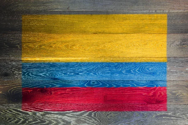 Colombia flag on rustic old wood surface background — Foto Stock
