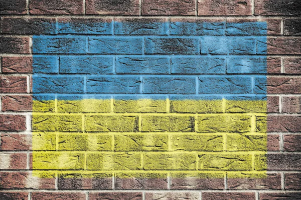 Ukraine flag on a brick wall background — Stock Photo, Image