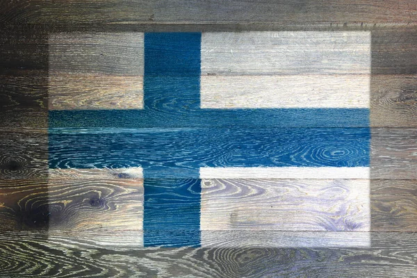 Finlandia bandiera su sfondo rustico vecchia superficie di legno — Foto Stock