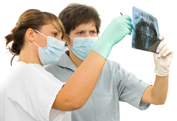 Two doctor examine the dental Rx Royalty Free Stock Images
