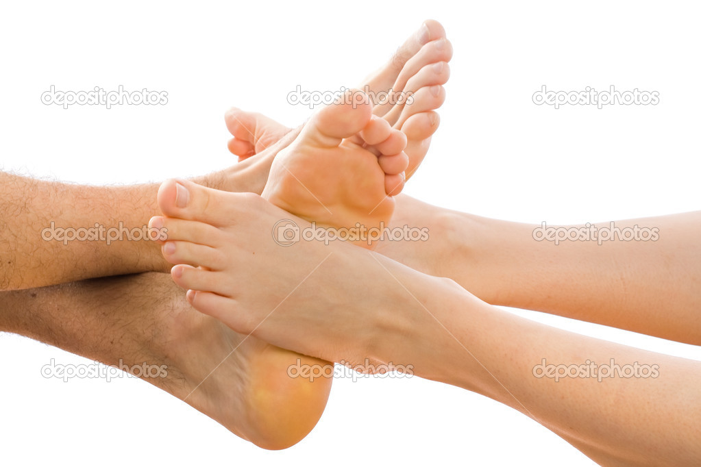 Young couple putting together the feet in the studio