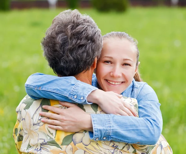 Elderly woman and her daughter — Stock Photo, Image