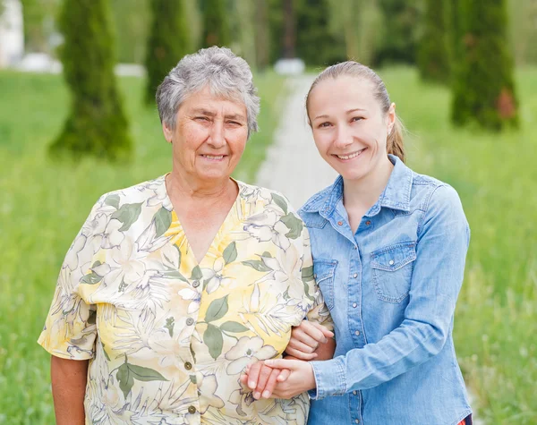 Elderly woman and her daughter — Stock Photo, Image