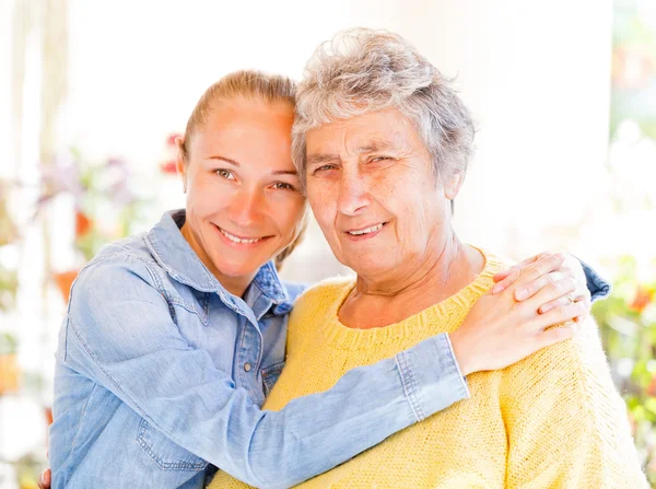 Elderly woman and her daughter — Stock Photo, Image