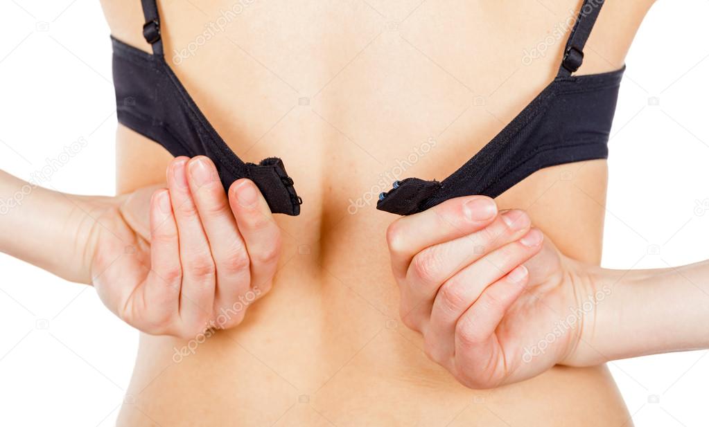 Woman taking off her bra