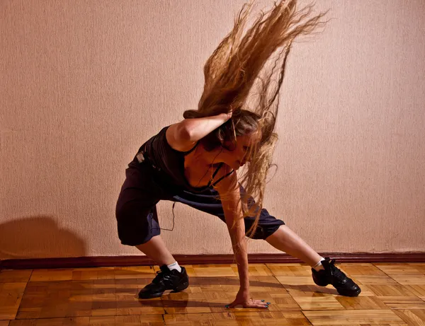 Beautiful girl with long hair dancing — Stock Photo, Image