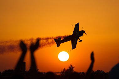 Air show at sunset clipart