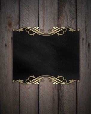 desen ahşap arka plan üzerinde siyah bir plaka üzerinde