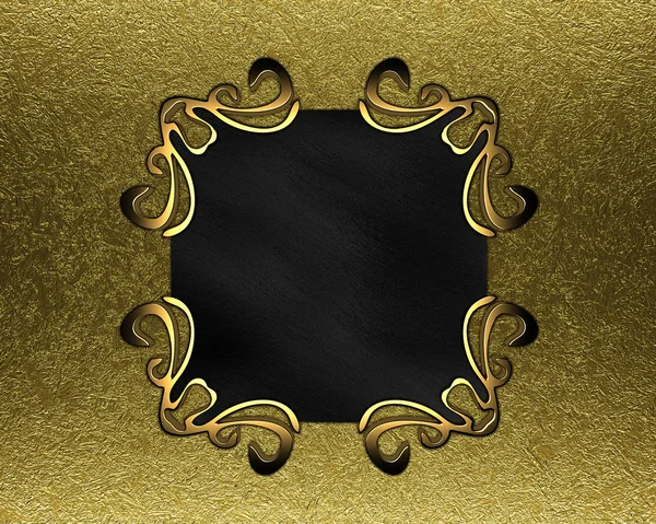 Black plaque with gold patterns on a background of gold — Stock Photo, Image