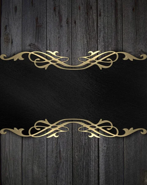 Black frame with a gold pattern on a wooden background — Stock Photo, Image