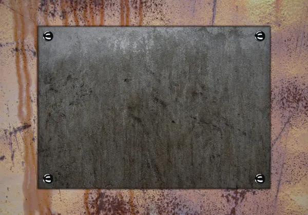Pared de metal oxidado con placa de nombre de piedra —  Fotos de Stock