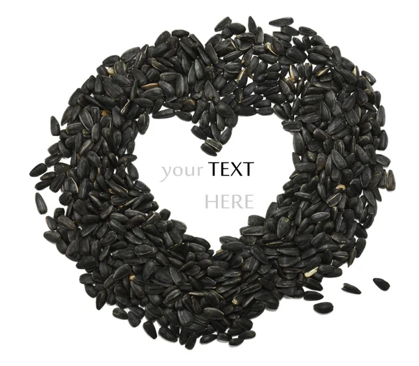 Sunflower seeds in a heart shape — Stock Photo, Image