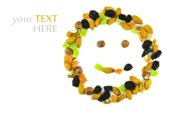 Nuts and dried fruit in the form of a smile, of isolation on a white background — Stock Photo, Image