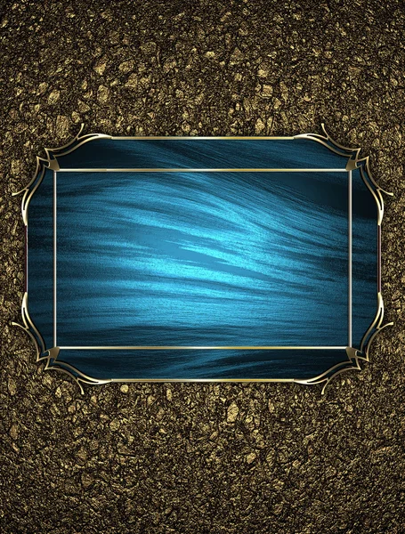 Textura de areia dourada com uma placa azul com bordas douradas — Fotografia de Stock