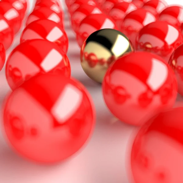 Złota piłka liderem na wielu czerwonych kulek — Zdjęcie stockowe