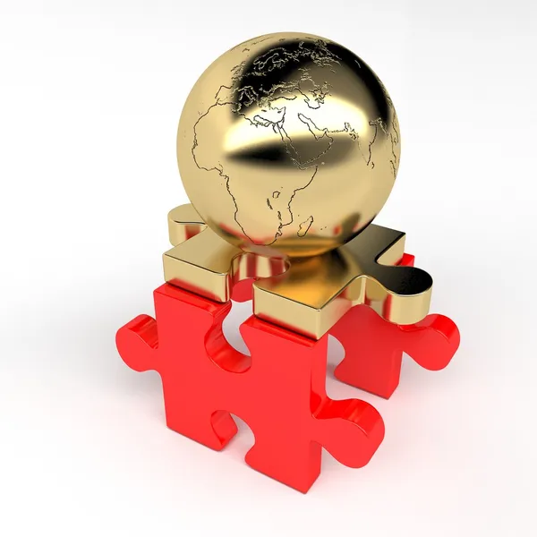 Puzzles and golden ball lands — Stock Photo, Image