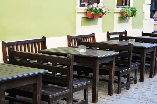 Outdoor street cafe tables and benches — Stock Photo, Image