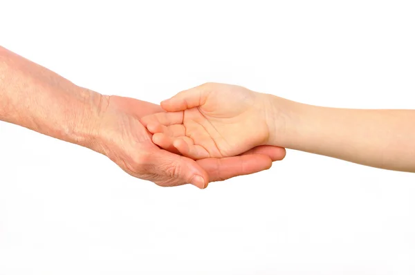 Un niño pone su mano en la palma de una anciana — Foto de Stock