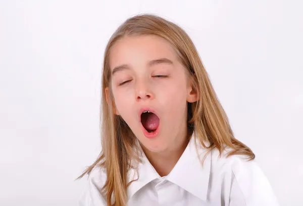Маленькая девочка зевает Лицензионные Стоковые Изображения
