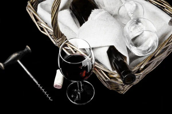 The wine glass and picnic basket on a black — Stock Photo, Image